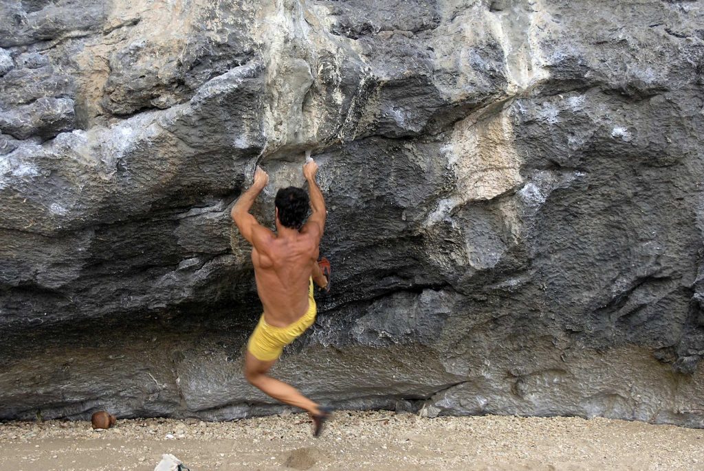 Rock climber making an ascent in Krabi
