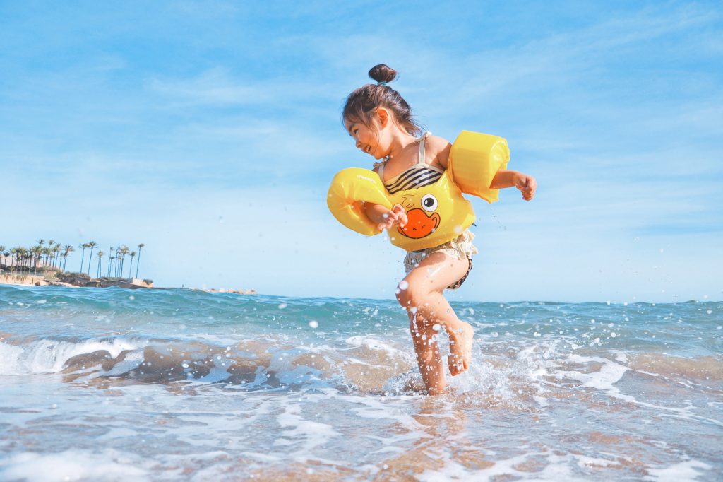 Child playing at beach, Thailand