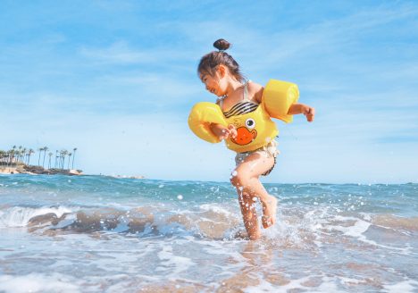 Child playing at beach, Thailand
