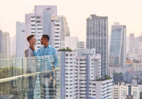 Two gay lovers at a rooftop bar in Bangkok.
