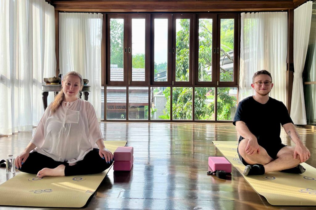 The newlyweds doing yoga at Aleenta Retreat Chiang Mai.