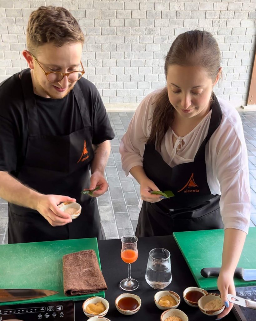 Ilana and Ren at a cooking class in Chiang Mai. Cooking classes are some of the best queer-friendly activities in Thailand.