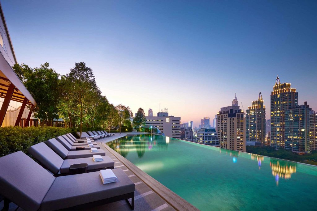 Park Hyatt Bangkok rooftop pool at night.