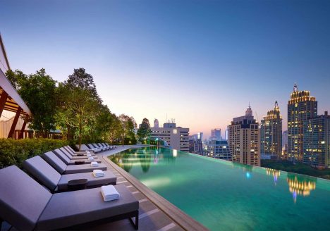 Park Hyatt Bangkok rooftop pool at night.