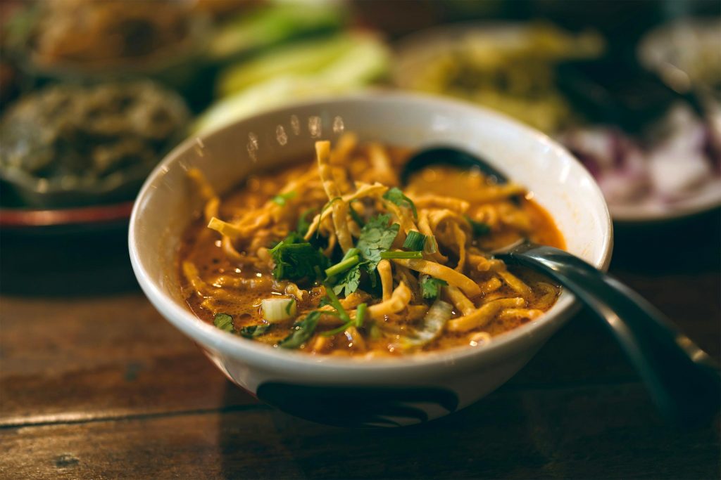 Khao Soi curry noodles at a restaurant in Chiang Mai, Thailand. One of the most popular Northern Thai dishes.