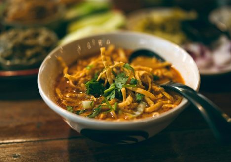 Khao Soi curry noodles at a restaurant in Chiang Mai, Thailand. One of the most popular Northern Thai dishes.