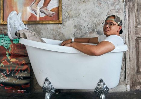 Surachai Saengsuwan poses in a bathtub for Songkran