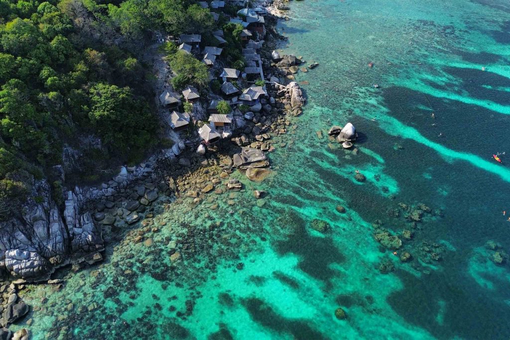 Bird's eye view of a resort against the coast of Koh Tao.