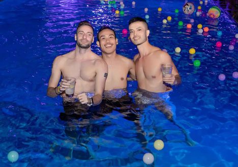 Three guys at a pool party in Bangkok