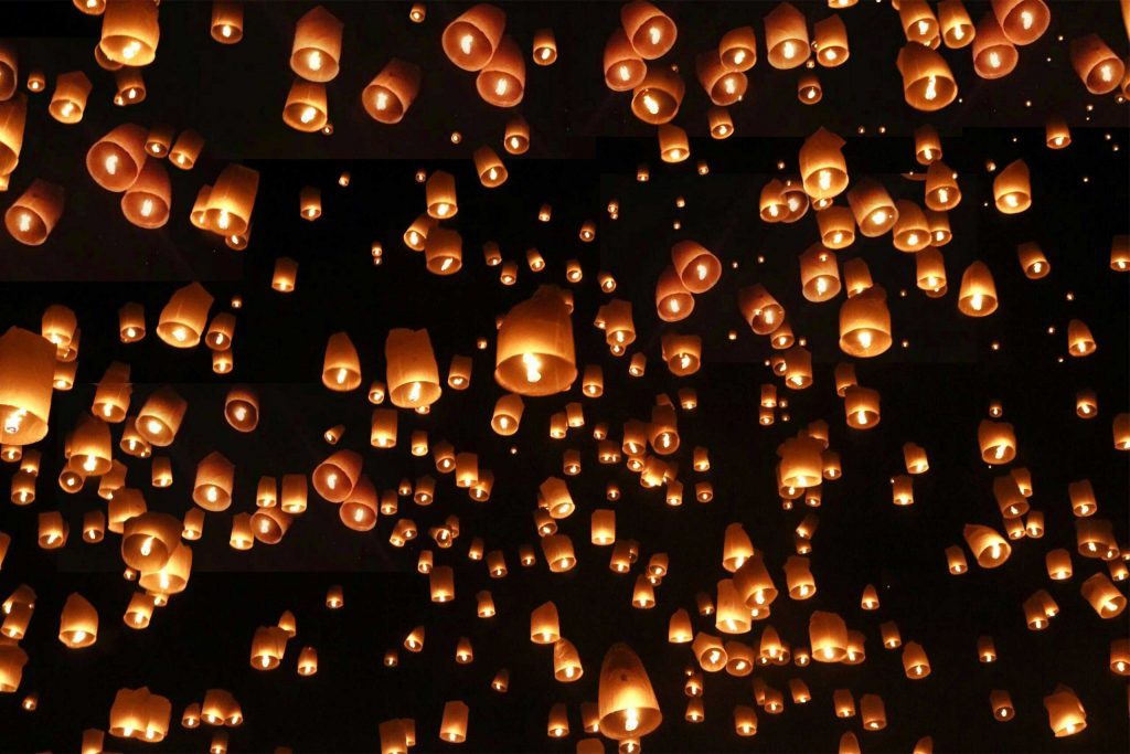 Lanterns fill the night sky during Yi Peng in Chiang Mai.