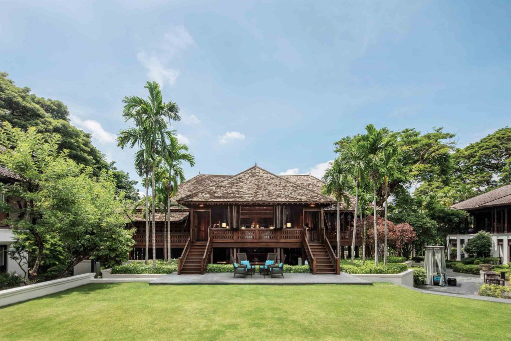 The green courtyard of 137 Pillars House luxury hotel.