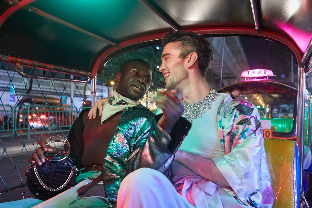 Two travellers in a tuk-tuk in Bangkok.