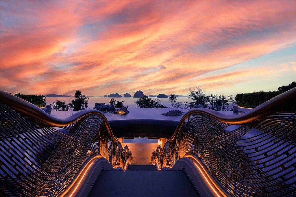 Sunset views from the grounds of a luxury hotel staircase.