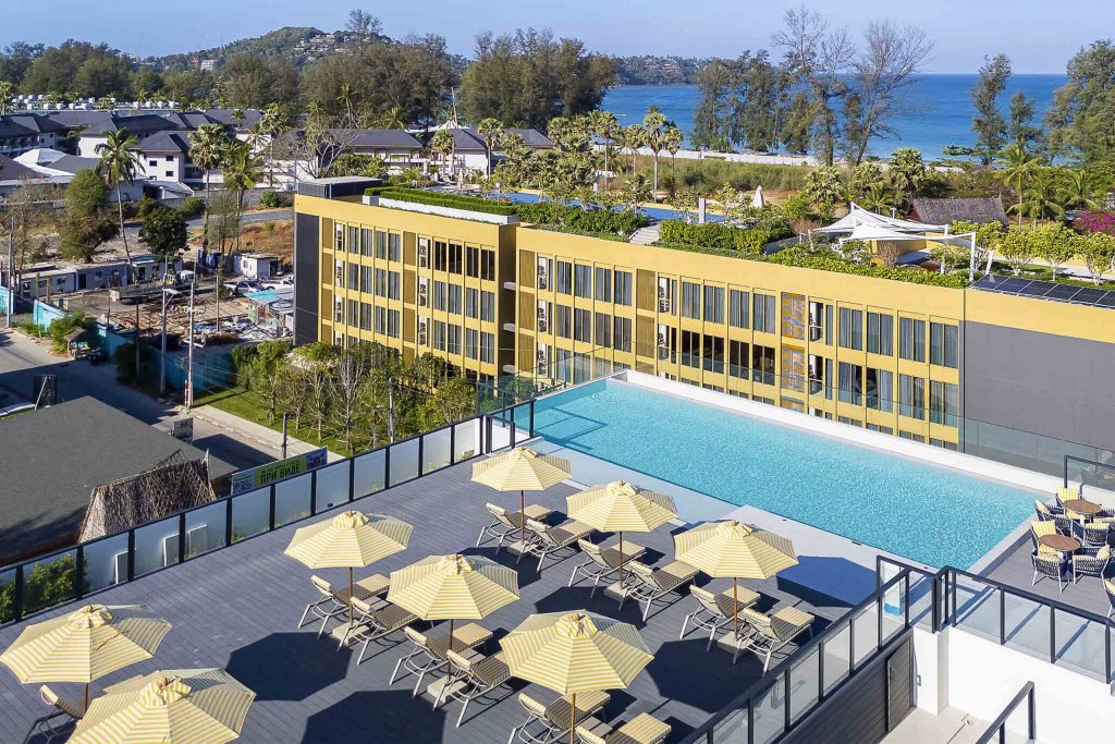 A rooftop pool with sun loungers.