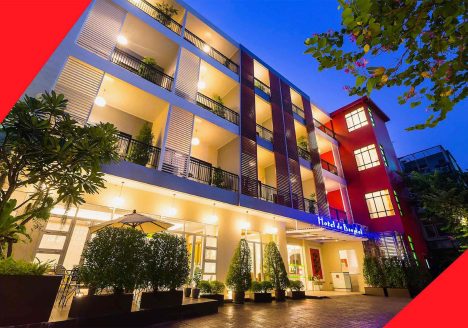 Hotel balconies lit up at night.